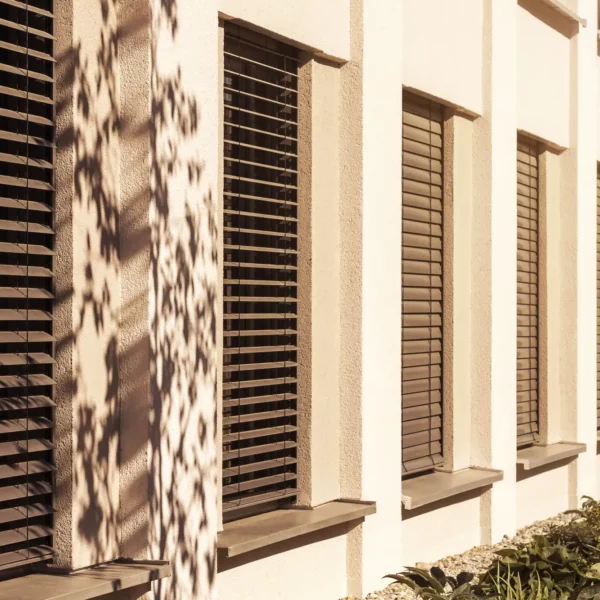 external-blind-shutters-outdoor-windows-modern-building-sunny-day-sun-protection-window